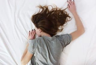 woman laying on bed